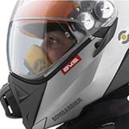 Fog inside a snowmobile helmet can be prevented by a breath evac system and a spring-loaded sun shield changes the visors according to the conditions