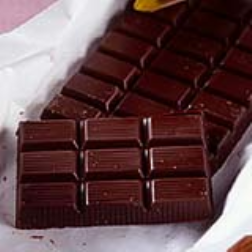 A regular chocolate bar with added grooves in its surface, makes it easier to break a piece off