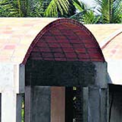 A thin hollow wall uses less bricks and reduces thermal conduction, keeping the house cool