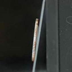 An array of microfibers that can keep objects from sliding down near-vertical surfaces