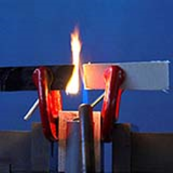 A non-flammable, high-strength lightweight composite material has been developed that is suitable for making liquid oxygen tanks for space flight services