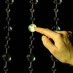 This light bead curtain consists of an interactive sound installation that light up and emit a sound when touched