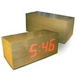 These clever clocks have a very thin layer of veneer that permits the LEDs to shine through