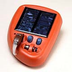 The SolarAid system combines a small hearing aid and a lightweight solar charger