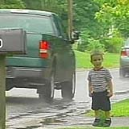 Cardboard cutouts of kids help to slow traffic
