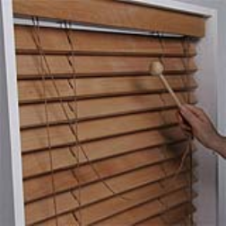 These wooden window blinds have a secondary purpose as a musical instrument