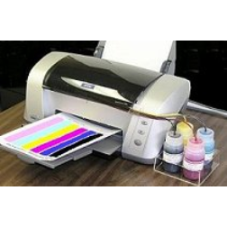 The printer ink is kept in bottles outside the printer housing and supplied to the printer by thin tubes