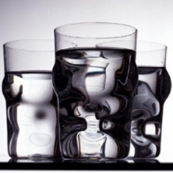 These glasses with alternating concave and convex forms, create interesting optical illusions when filled with liquid