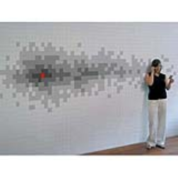 The 4 layered wallpaper is applied to a brightly painted wall consisting of a different tone of grey