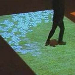An interactive floor projection that reacts to people passing by or over the projection