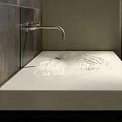 Concrete sink with contour "erosion" lines