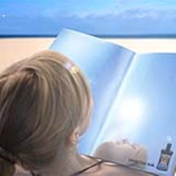This magazine has reflective pages that let you suntan while reading