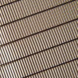 Koolshade is a screen of tiny bronze louvres that are installed in an aluminium frame on the outside of the window blocking out the sun and providing your building with total shade