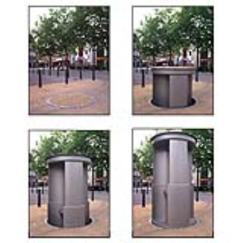 A stainless steel cylinder with three urinals that descend below street level during the day and lifted up to sidewalk level at night