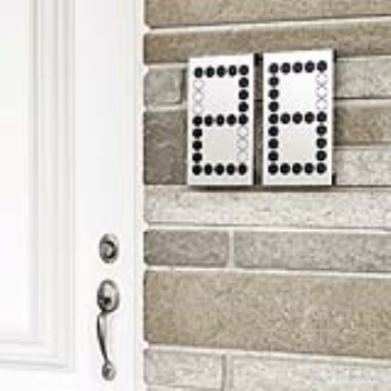 This system for numbering a house has adjustable tabs