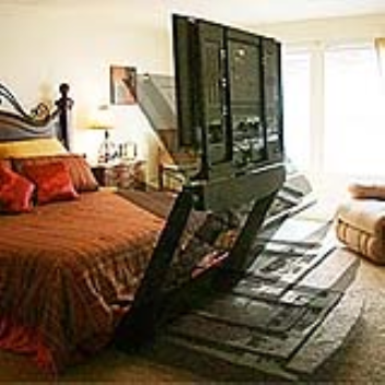 The Underbed lift hides a 50 inch tv under a bed