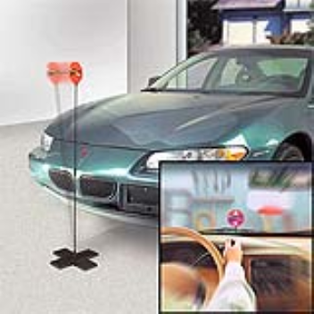 A simple fiberglass pole with a warning sign for parking