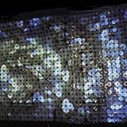 an elastic architectural surface made up of small metal plates