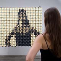 A mirror which makes an image by changing colour on each weave