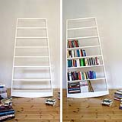 A bookshelf which tilts when books are added
