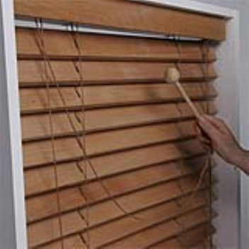 These wooden window blinds have a secondary purpose as a musical instrument