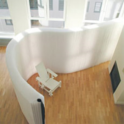 This paper softwall is a lightweight flexible wall that can be adjusted to the space required