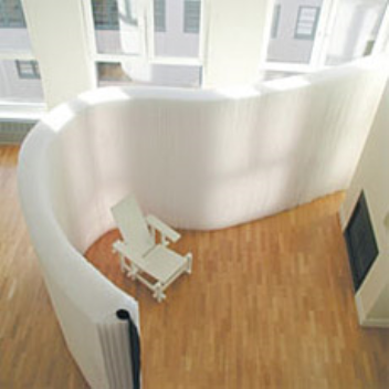 This paper softwall is a lightweight flexible wall that can be adjusted to the space required